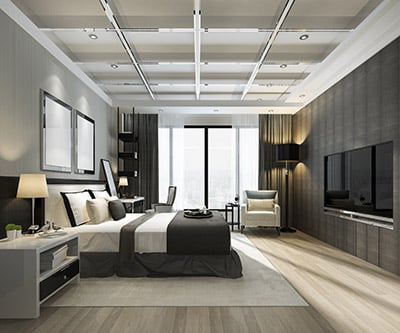 Modern bedroom with a neutral color palette, king-sized bed, contemporary furniture, large window, elegant lighting, and a flat-screen TV on the wall.