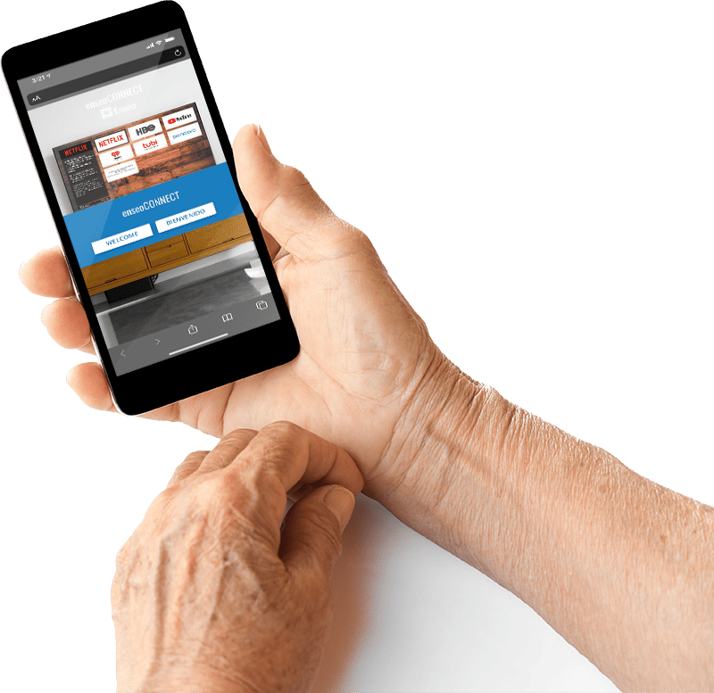 A person's hands holding a smartphone displaying various multimedia and streaming service icons on the screen. The background is not visible.