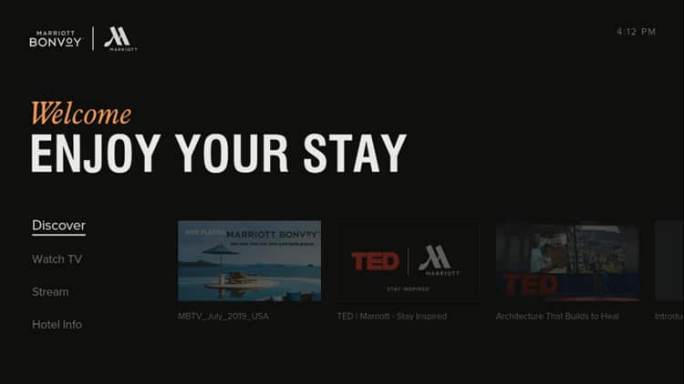 This is a welcome screen from a Marriott Bonvoy hotel's interactive TV system, featuring options like Watch TV, Stream, and Hotel Info with a timestamp at the corner.