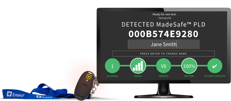 MadeSafe PLD and MadeSafe Station during test mode. The employee safety device is attached to a blue lanyard with the indicator light on. The MadeSafe station says "DETECTED Madesafe PLD" with a long ID number, followed by the name "Jane Smith." The screen and PLD indicate that the device and system are functioning as expected.