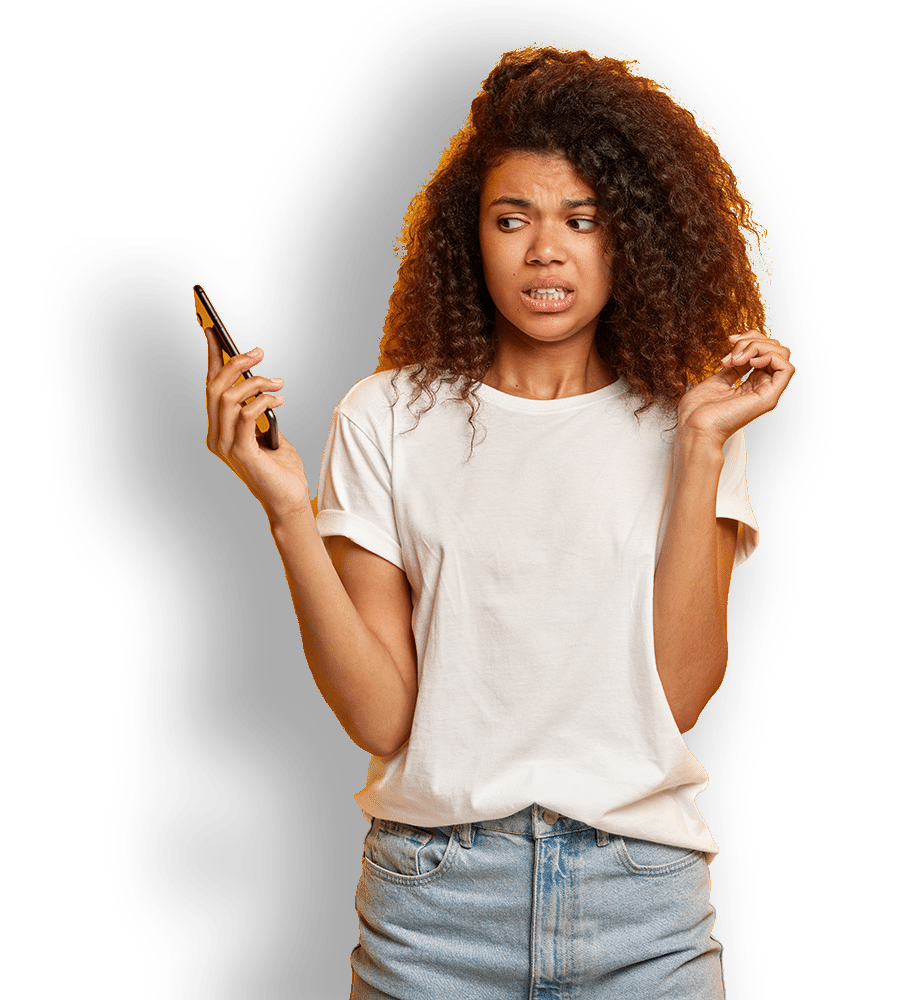 A confused woman looks at her smartphone with dread