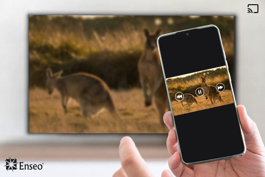 Casting by Enseo as demonstrated by a hand tapping on a smartphone with a TV screen mirroring in the background.